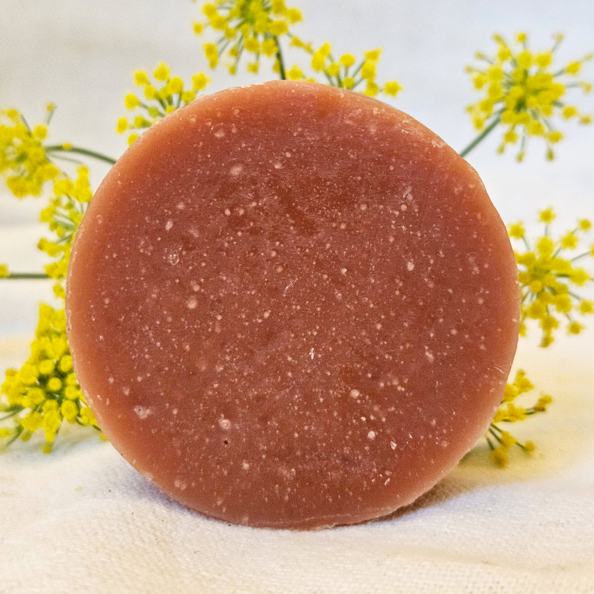 Frankincense Milk Face Wash bar with yellow flowers