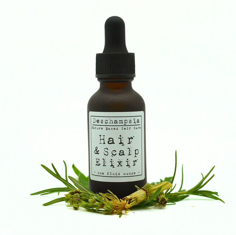Hair & Scalp Elixir bottle with evergreen branches